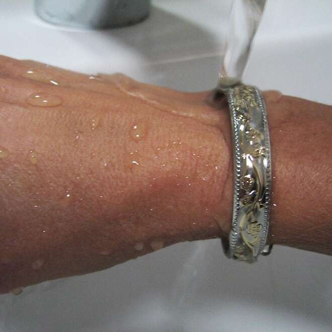 Magnetic bracelet with intricate design in a silver and gold finish